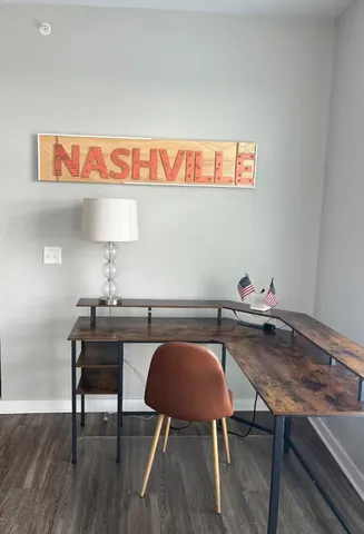 a view of a workspace with furniture