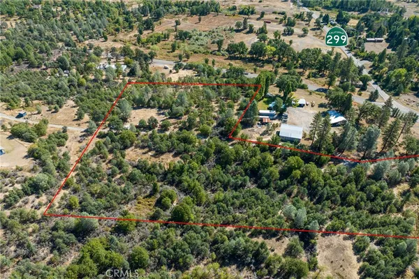 an aerial view of a houses with a yard