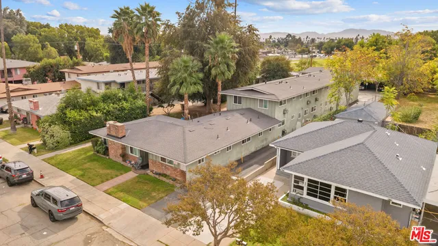 an aerial view of a house with a garden