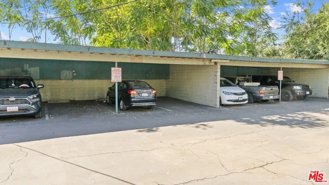 a car parked in the back yard of a house