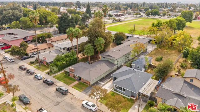 an aerial view of residential houses with outdoor space
