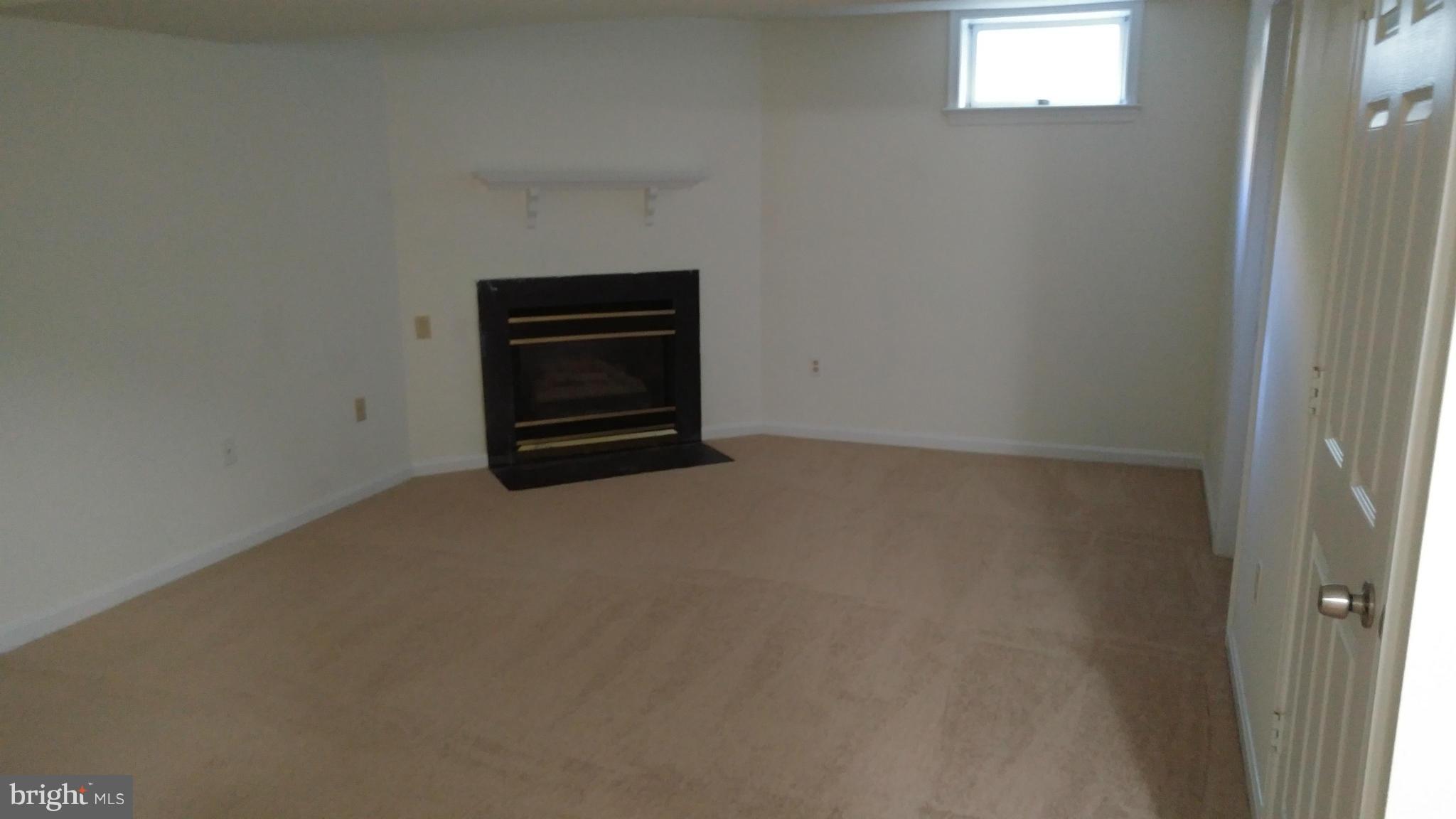 2435 Prentice Court Frederick, MD 21702 - Photo 23 of 25 Family Room with fireplace