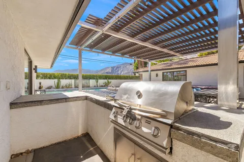 a view of an chairs and tables in the patio