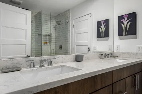 a living room with furniture and chandelier