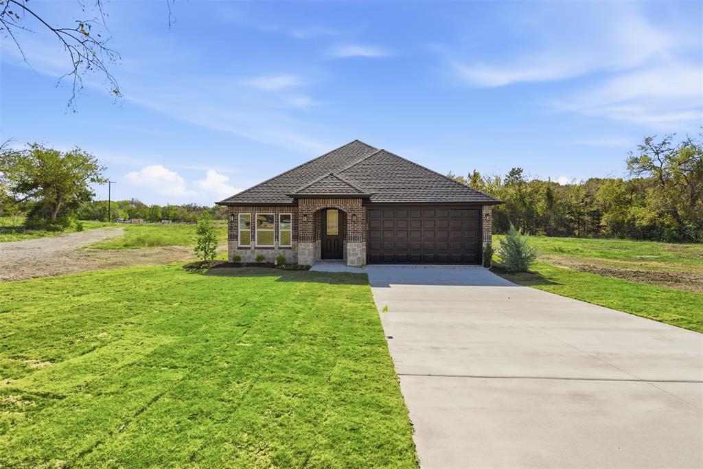 412 Ball Street Tom Bean, TX 75491 - Photo 1 of 1 a front view of a house with garden