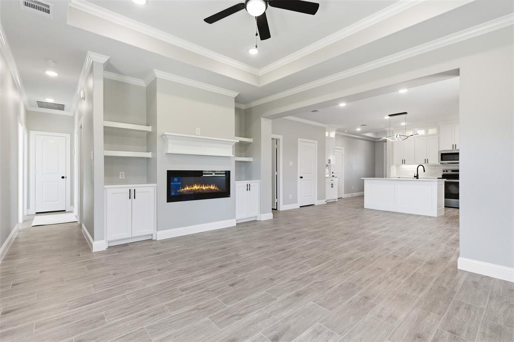 412 Ball Street Tom Bean, TX 75491 - Photo 21 of 28 a view of an empty room with a kitchen