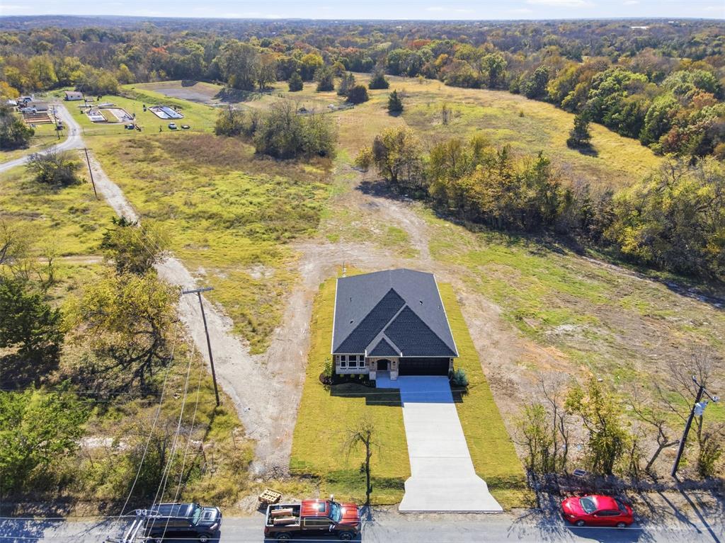 412 Ball Street Tom Bean, TX 75491 - Photo 23 of 28 an aerial view of residential houses with outdoor space