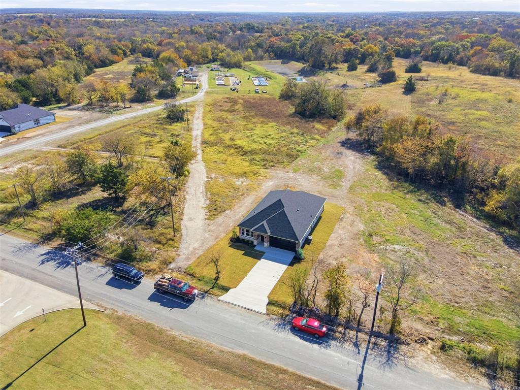 412 Ball Street Tom Bean, TX 75491 - Photo 24 of 28 an aerial view of residential houses with outdoor space