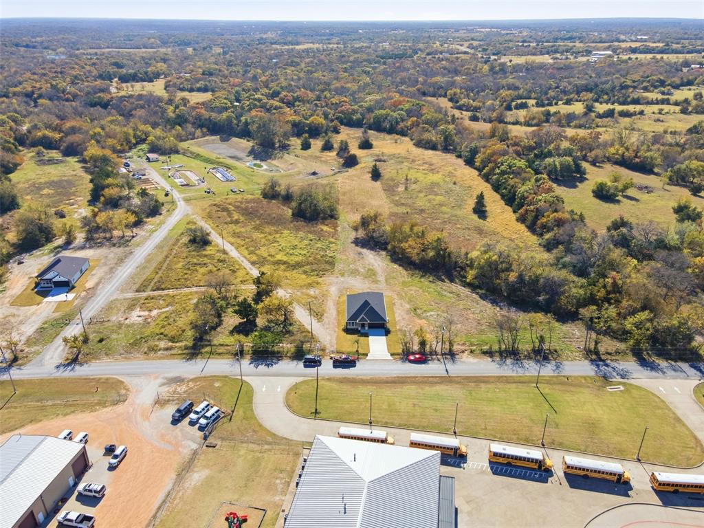 412 Ball Street Tom Bean, TX 75491 - Photo 26 of 28 an aerial view of residential houses with outdoor space