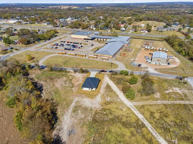 an aerial view of residential houses with outdoor space