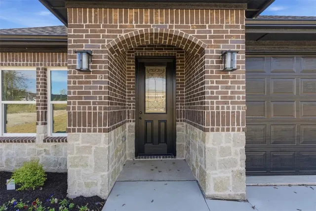 a front view of a house with a garage