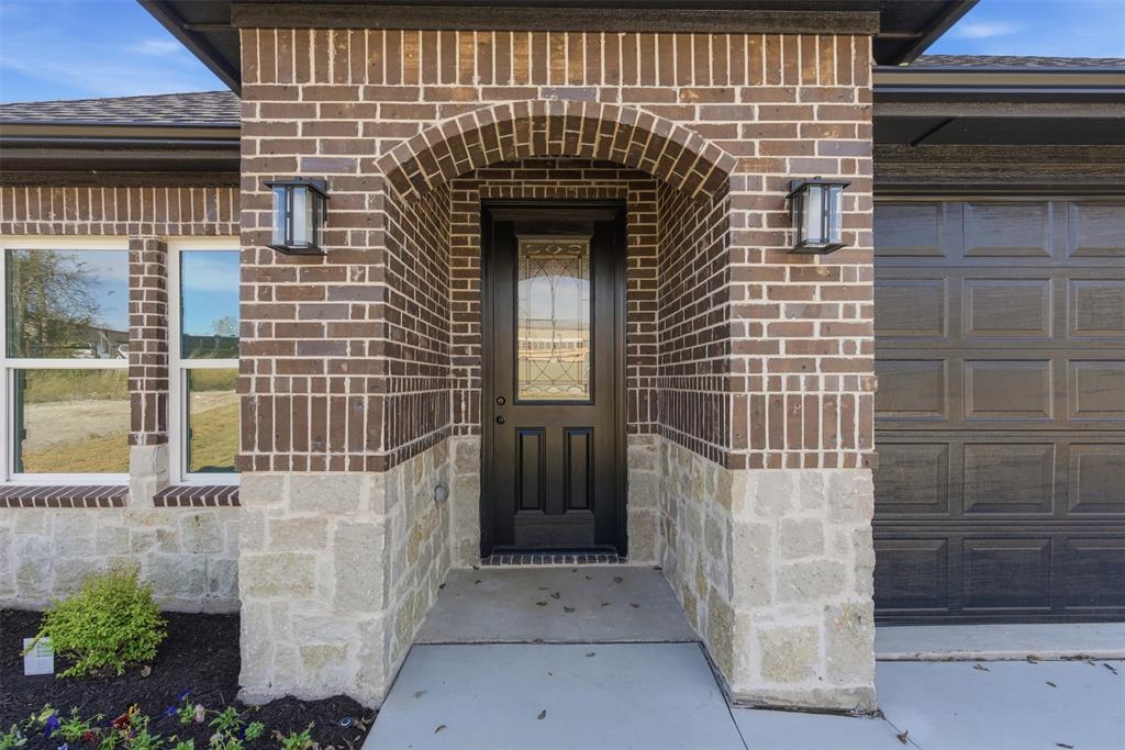 412 Ball Street Tom Bean, TX 75491 - Photo 3 of 28 a front view of a house with a garage