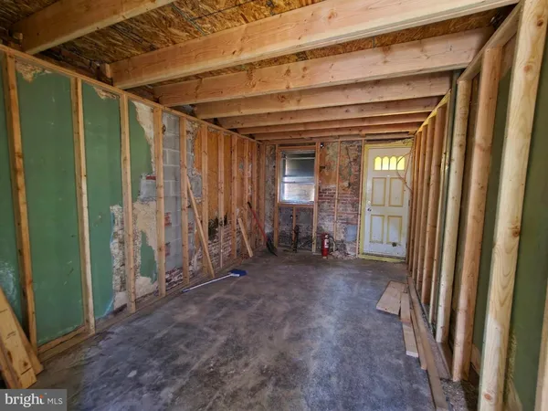 a view of a porch with wooden floor and stairs