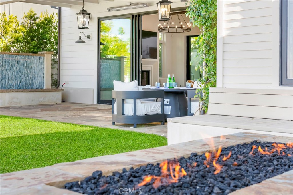 5 Rancho Elastico Road Rolling Hills Estates, CA 90274 - Photo 18 of 48 a view of a patio with a table and chairs and potted plants