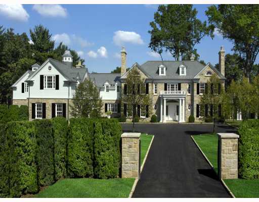 Undisclosed Address Greenwich, CT 06830 - Photo 2 of 10 a front view of a house with a garden