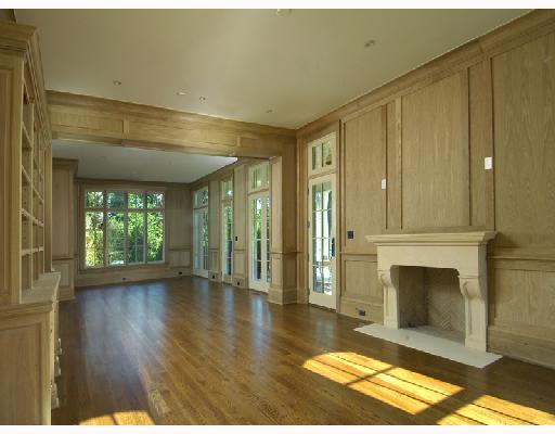Undisclosed Address Greenwich, CT 06830 - Photo 6 of 10 a view of an empty room with a fireplace and a window