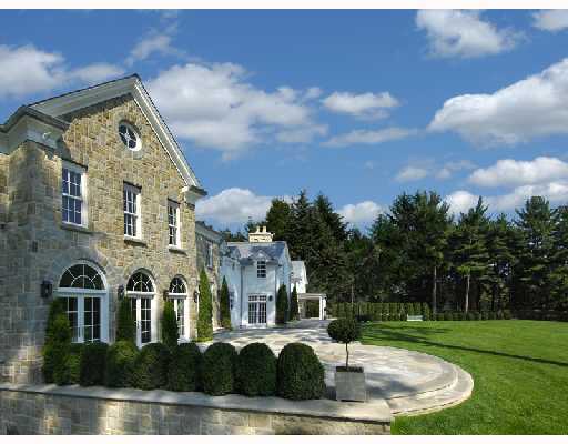 Undisclosed Address Greenwich, CT 06830 - Photo 7 of 10 a front view of a house with garden