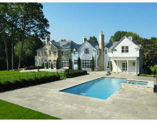Undisclosed Address Greenwich, CT 06830 - Photo 8 of 10 a front view of a house with a yard and potted plants