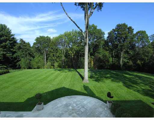Undisclosed Address Greenwich, CT 06830 - Photo 9 of 10 a view of a backyard with green space