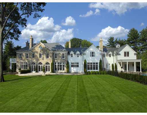 Undisclosed Address Greenwich, CT 06830 - Photo 10 of 10 a front view of a house with a garden