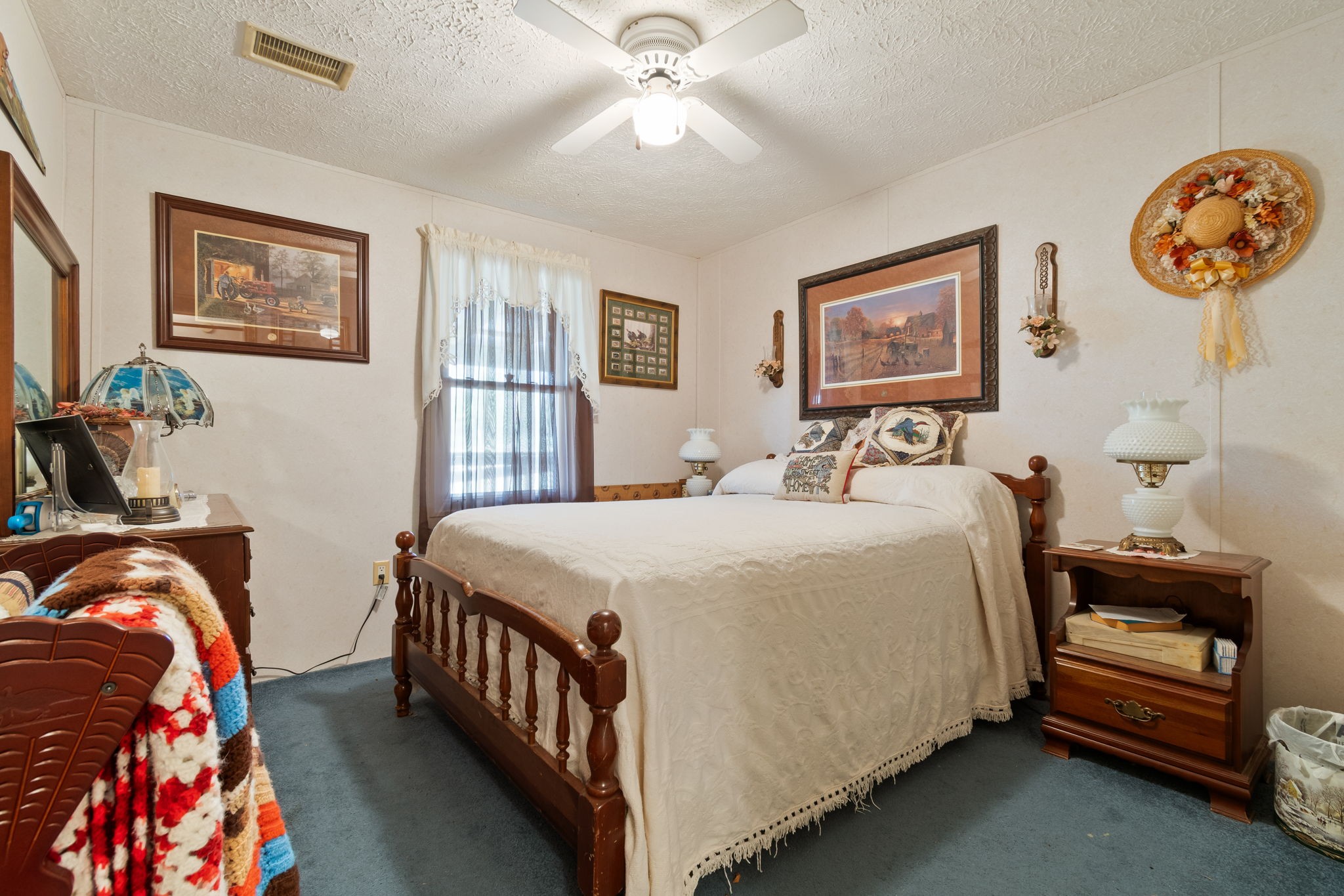 1300 New She Boss Road Duck River, TN 38454 - Photo 13 of 56 a bedroom with bed and a chandelier