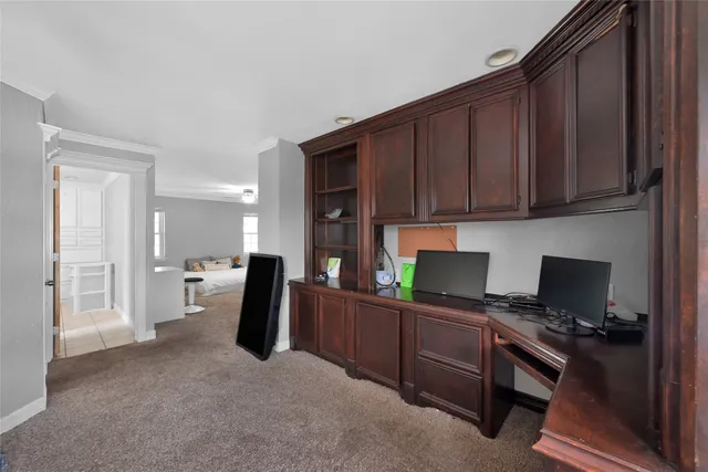a kitchen with a refrigerator and a stove top oven