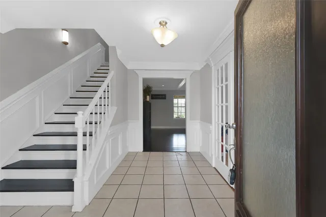 a view of a hallway view with staircase