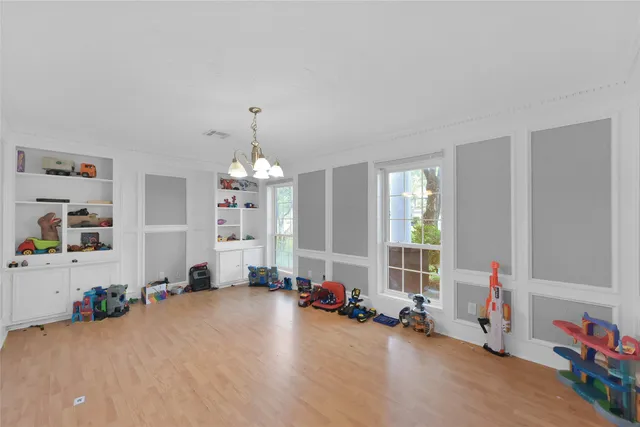 a view of a room with gym equipment and a large window