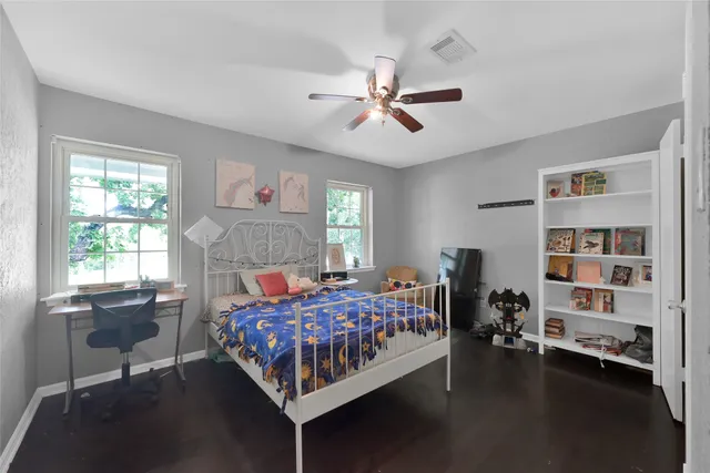 a bedroom with a bed furniture and a window