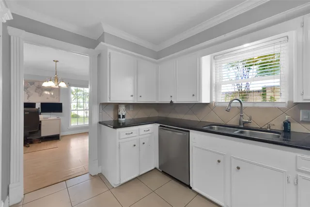 a kitchen with a sink and cabinets