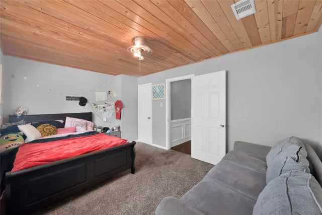 a bedroom with a bed and a walk in closet