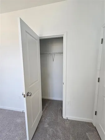 a bathroom with a double vanity sink toilet and shower