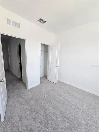 a view of an empty walk in closet