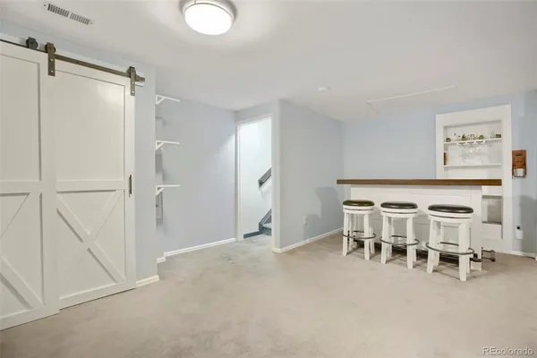 a view of a livingroom with furniture and windows