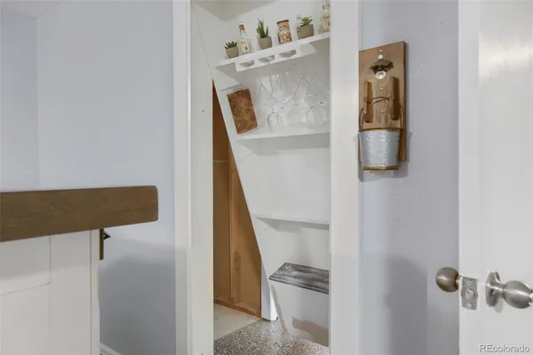 walk in closet with wooden floor washer and dryer
