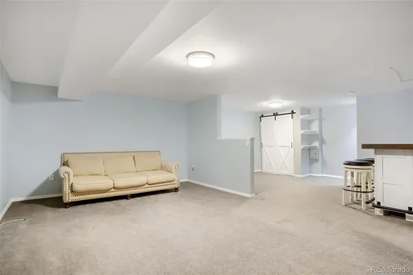a living room with furniture and a couch