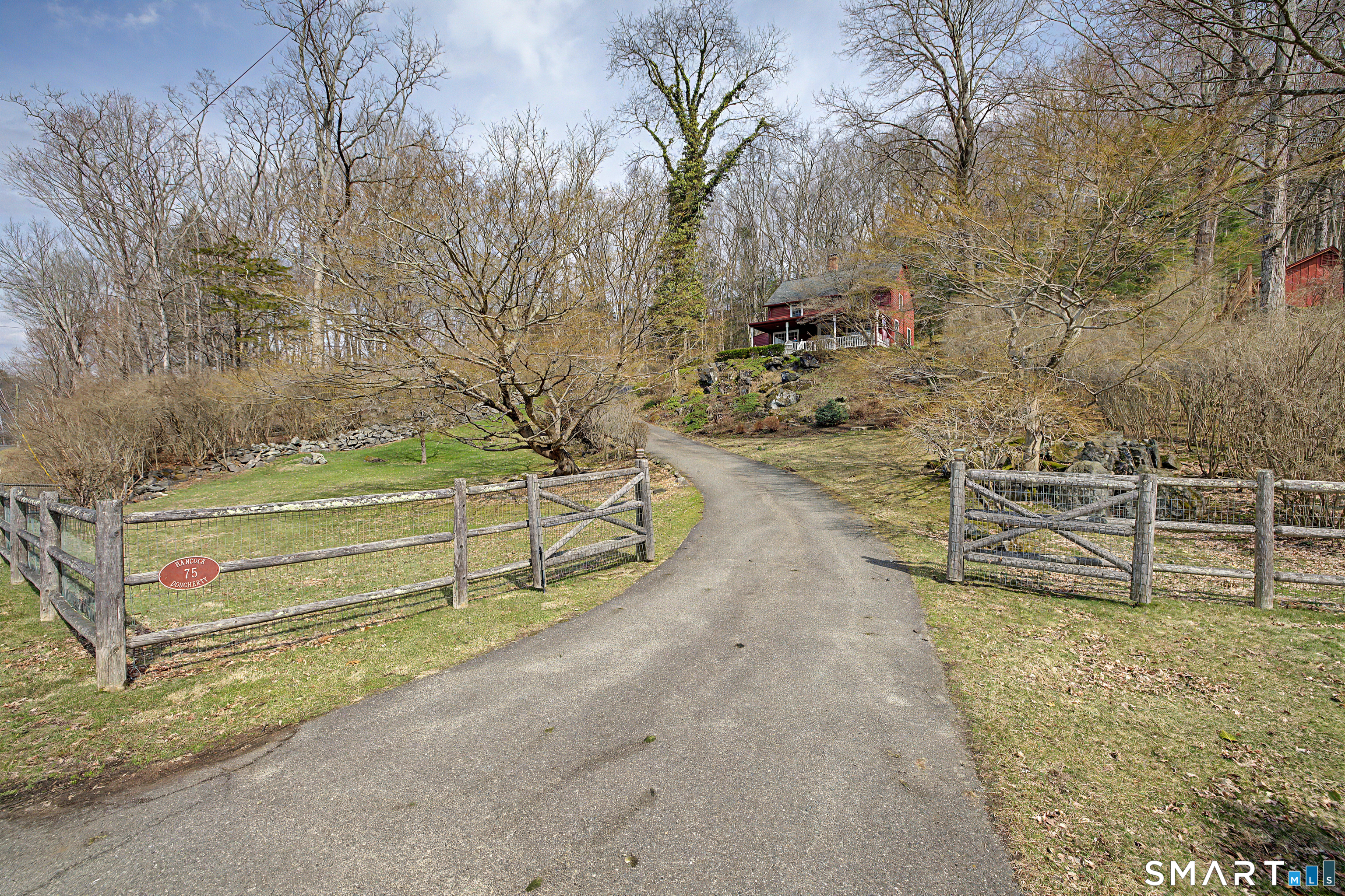 a view of a backyard with wooden fence
