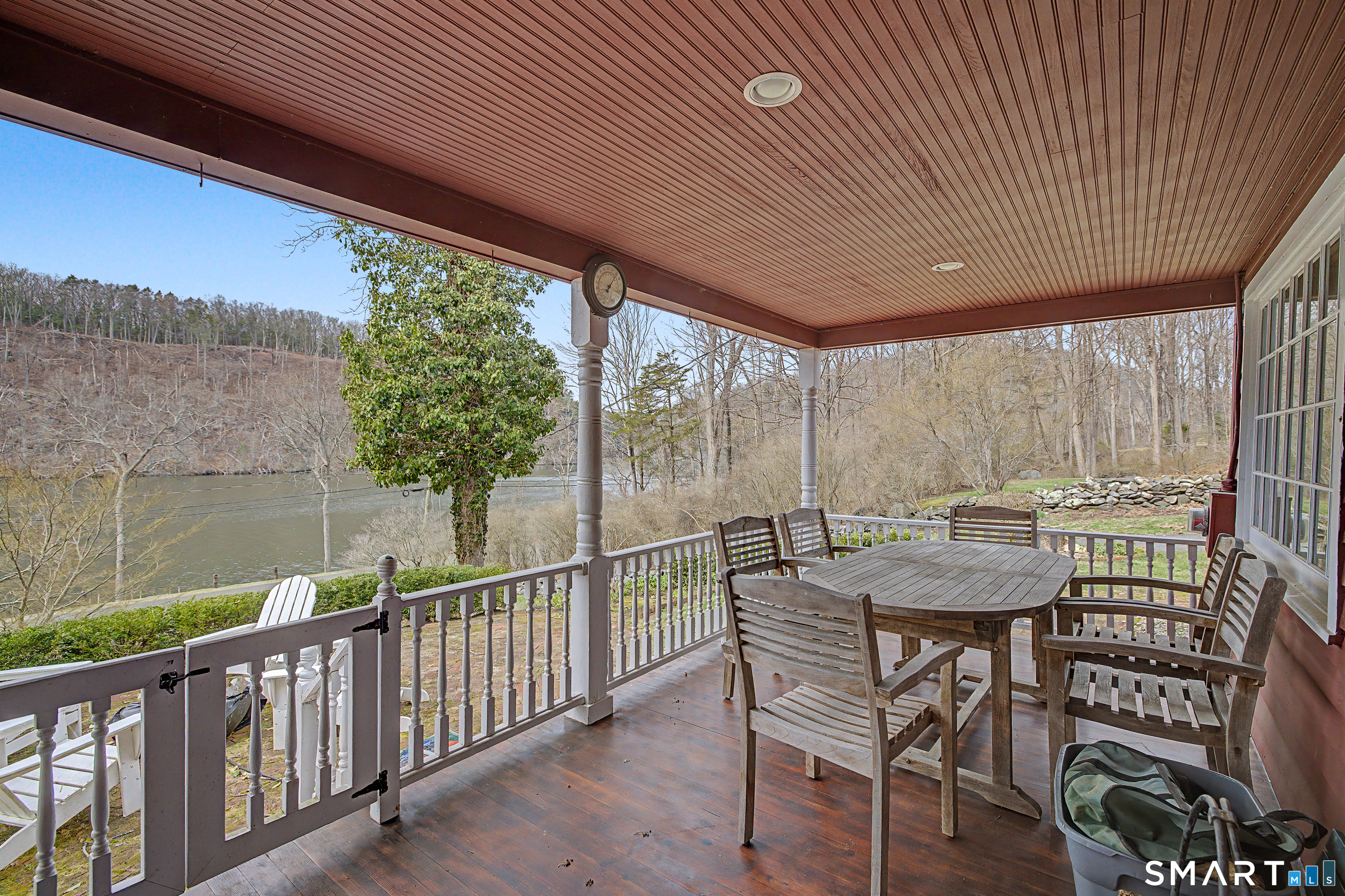 75 Lake Lillinonah Road North Bridgewater, CT 06752 - Photo 3 of 18 a view of a patio with a table chairs and a table