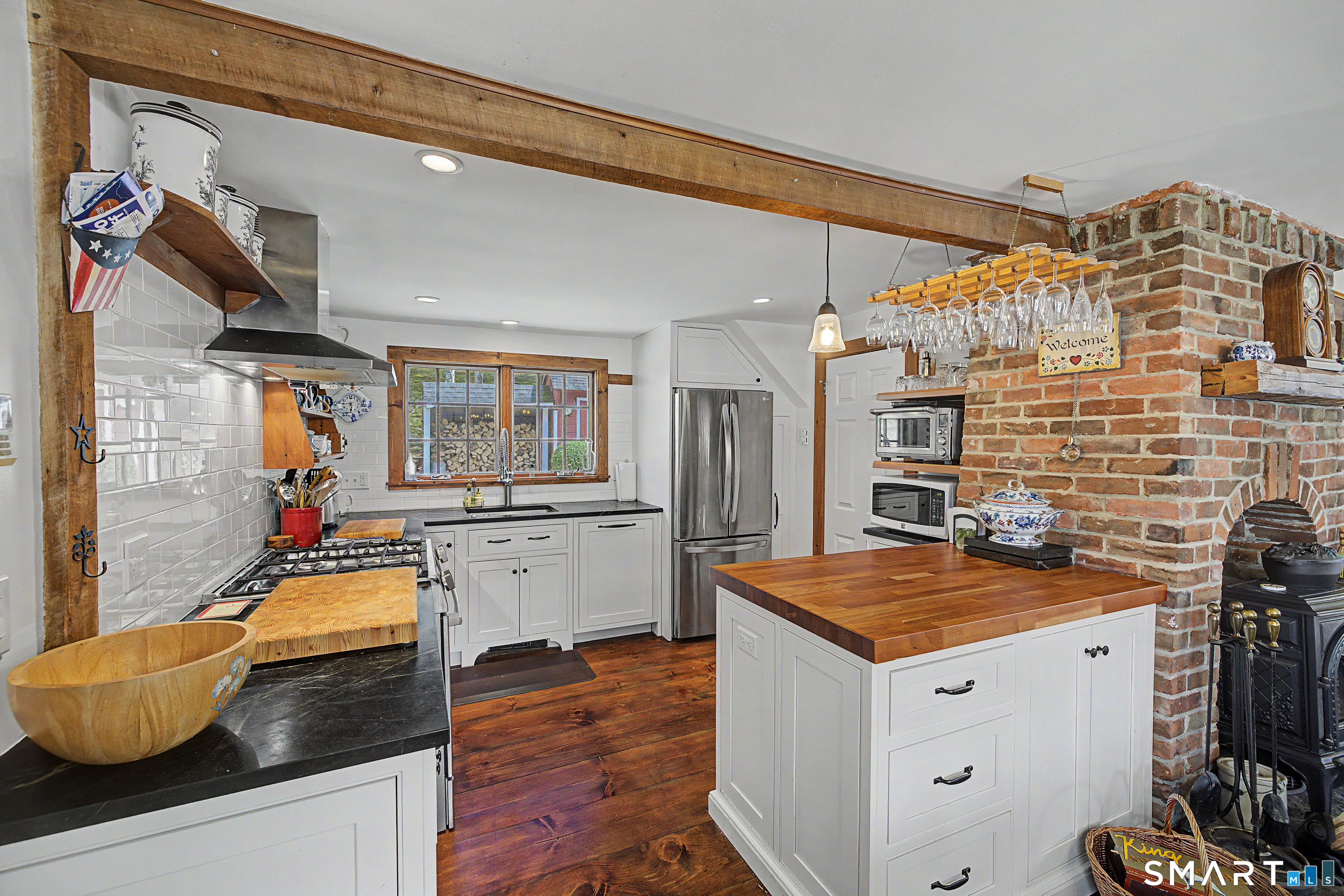 75 Lake Lillinonah Road North Bridgewater, CT 06752 - Photo 7 of 18 a kitchen with granite countertop kitchen island stainless steel appliances a stove and refrigerator