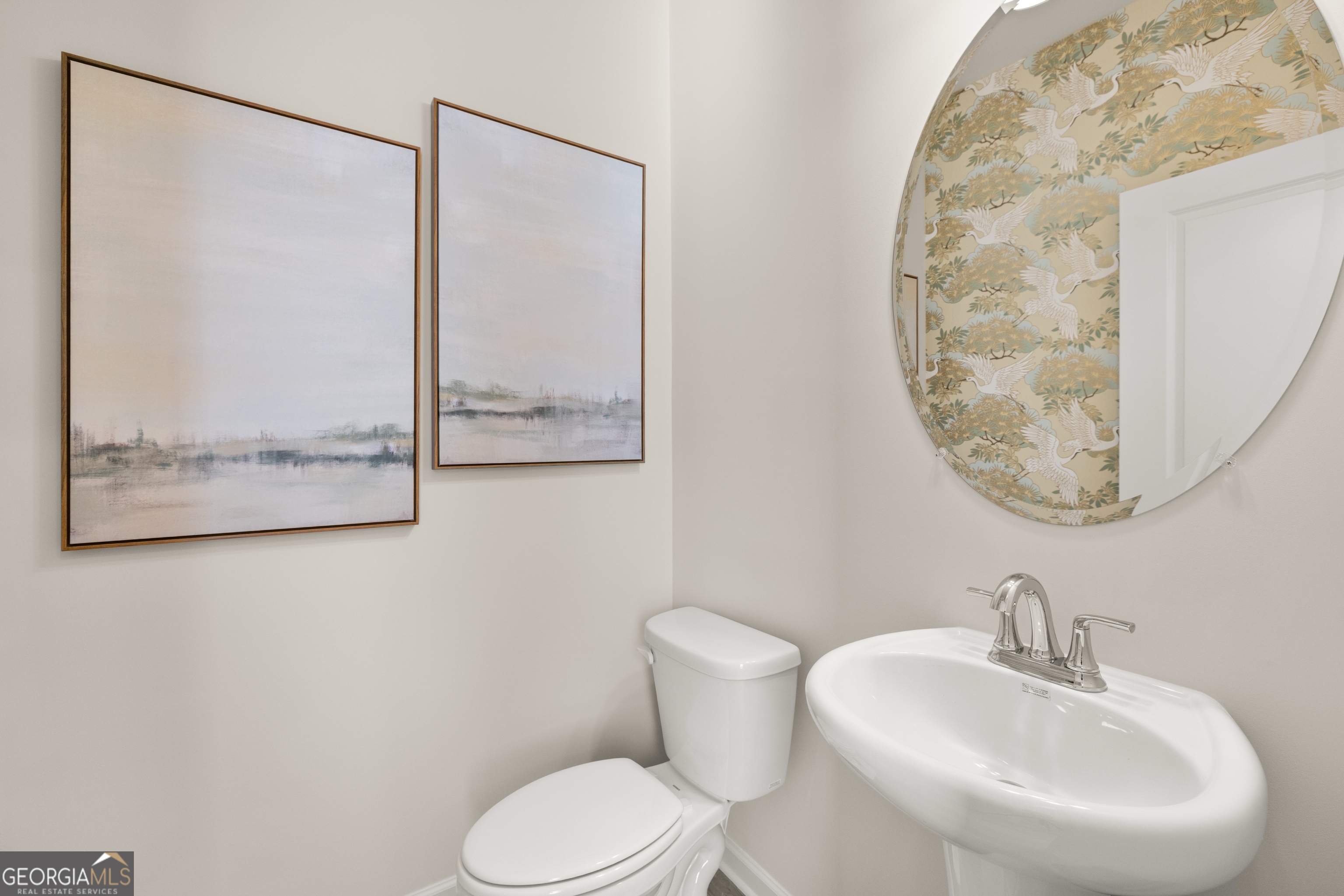 3263 Lake Carlton Road, Unit 23 Loganville, GA 30052 - Photo 17 of 33 a bathroom with a toilet and a sink