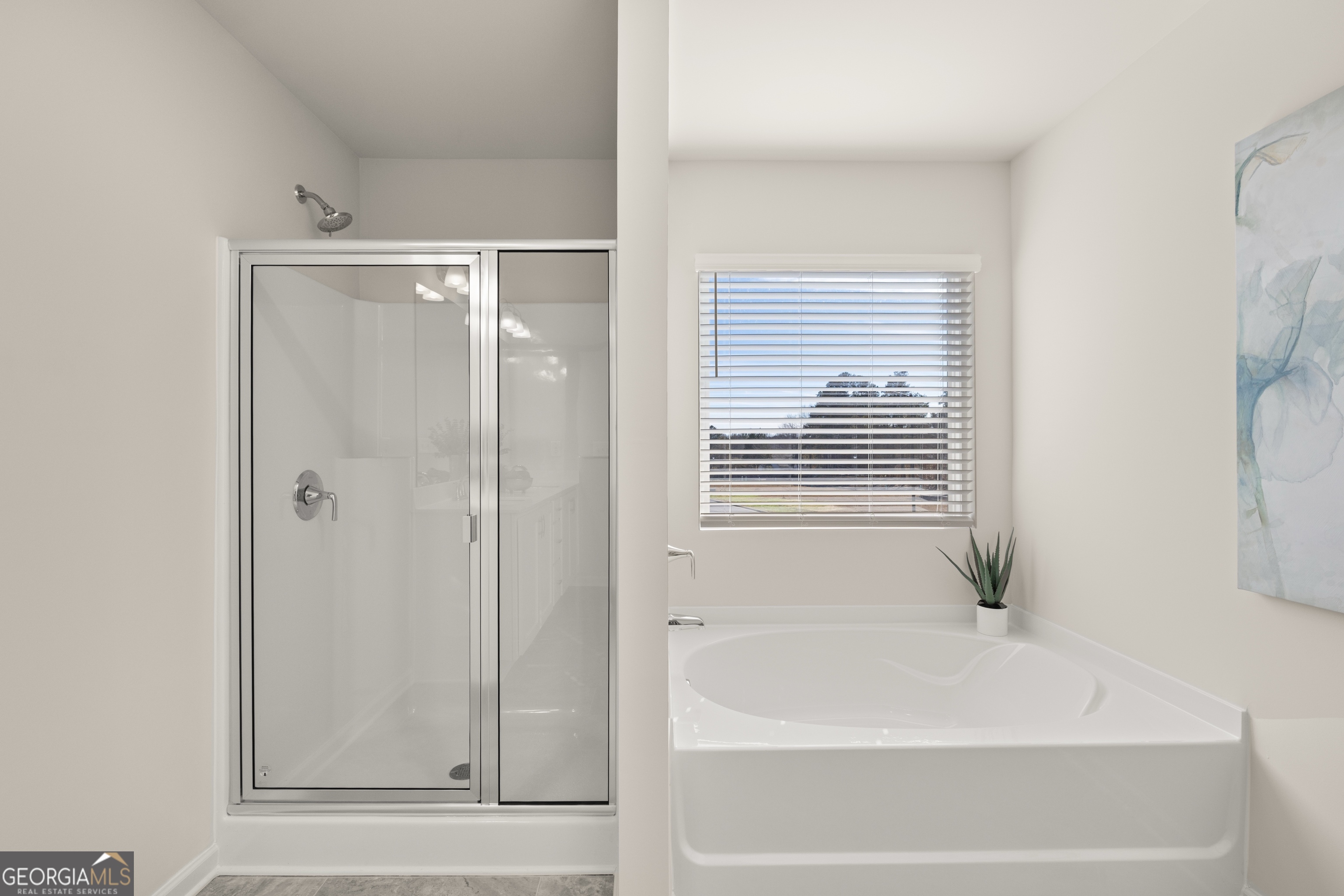3263 Lake Carlton Road, Unit 23 Loganville, GA 30052 - Photo 26 of 33 a bathroom with bathtub and shower