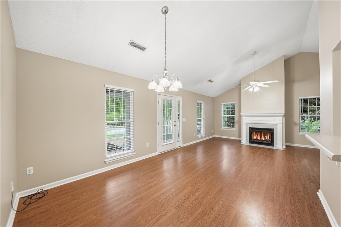 101 Grand Oak Circle Pendleton, SC 29670 - Photo 9 of 40 A welcoming interior with high vaulted ceilings and a cozy fireplace, perfect for gathering.