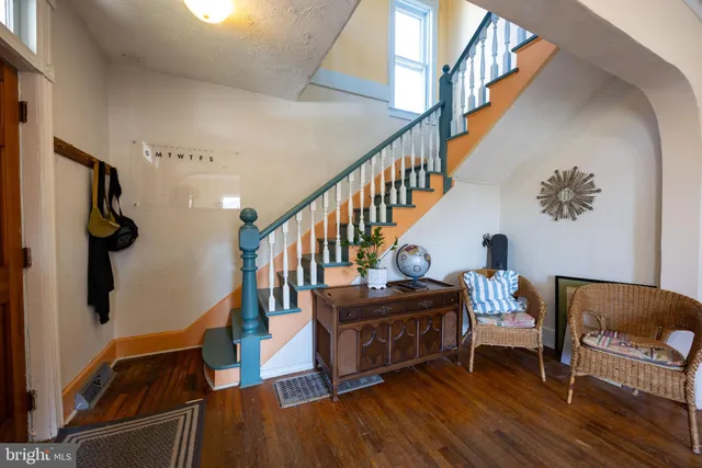 a living room with furniture and a rug