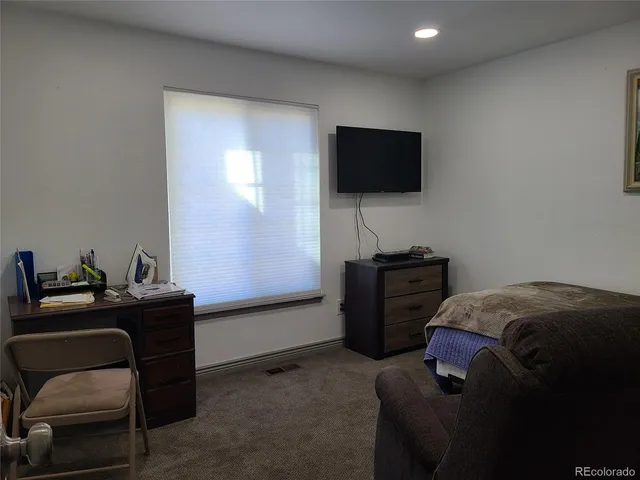 a room with furniture and a flat screen tv