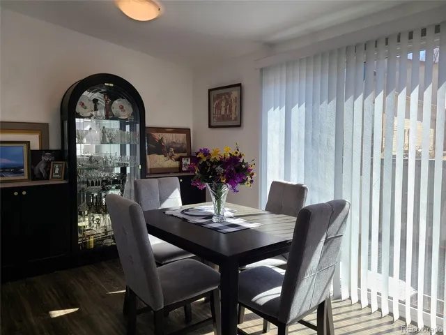 a view of a dining room with furniture and window