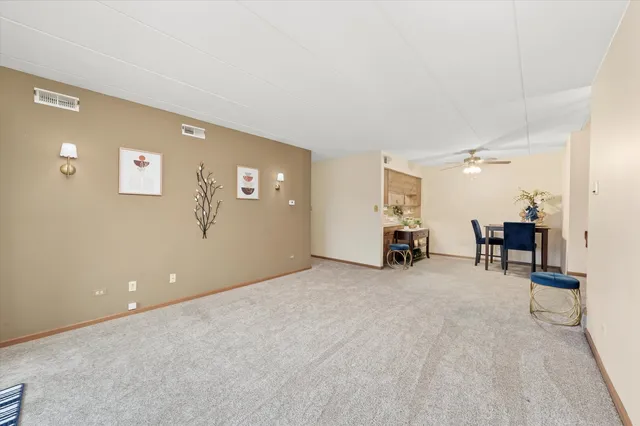 a view of a livingroom with furniture and a flat screen tv