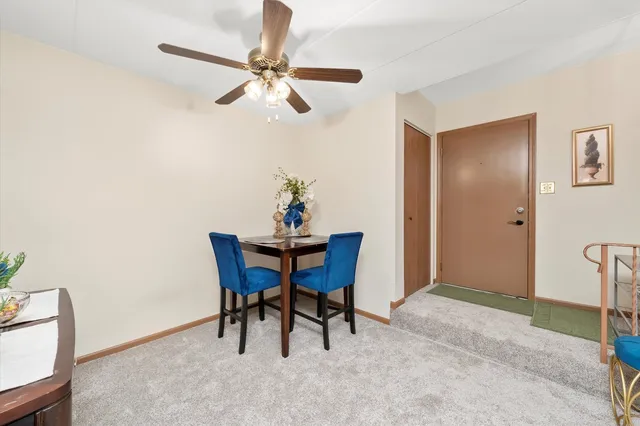 a dining room with furniture and window
