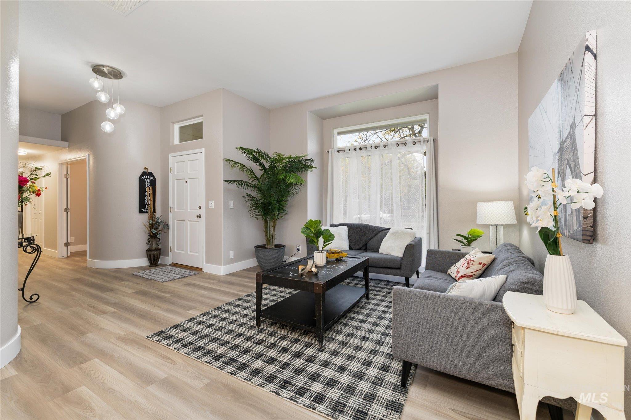2250 North Amethyst Avenue Meridian, ID 83646 - Photo 6 of 50 Living area with light wood finished floors and baseboards