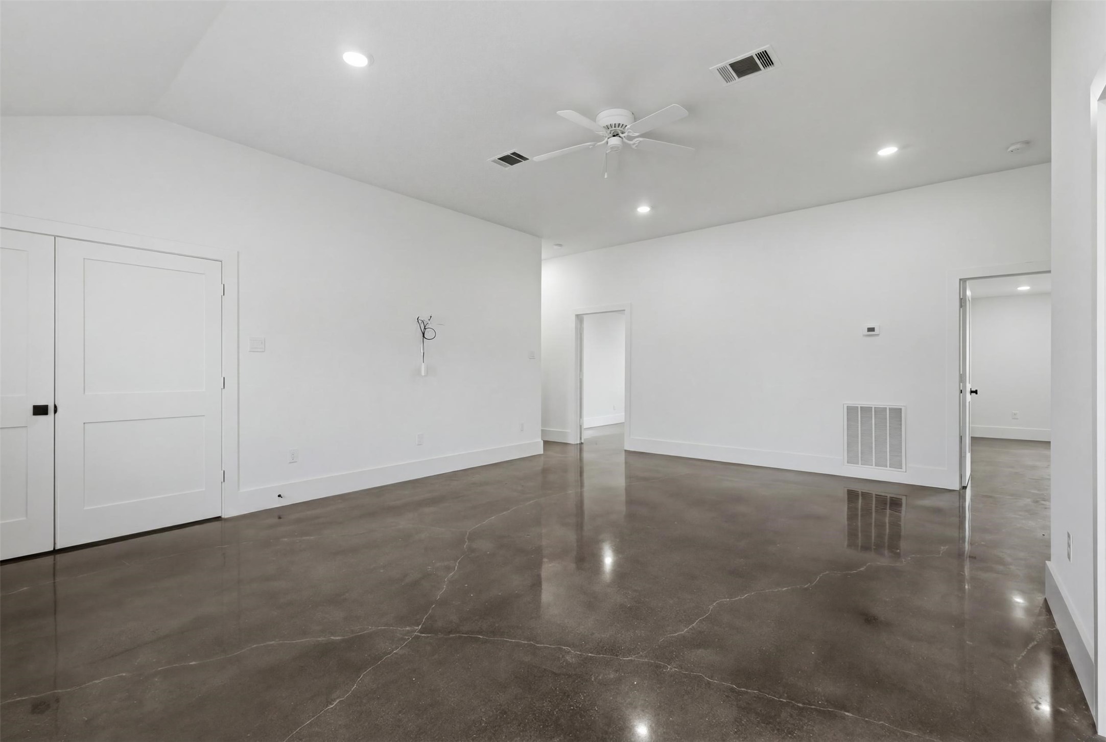 1589 County Road 252 Anderson, TX 77830 - Photo 40 of 50 an empty room with wooden floor and windows