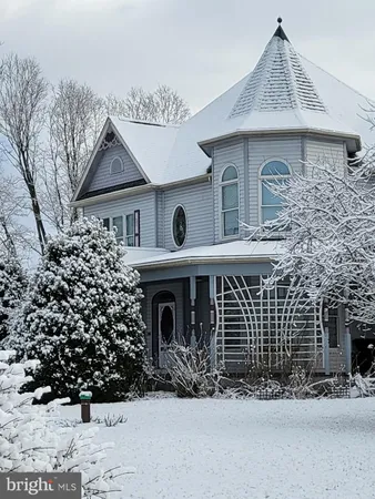 front view of a house with a fence